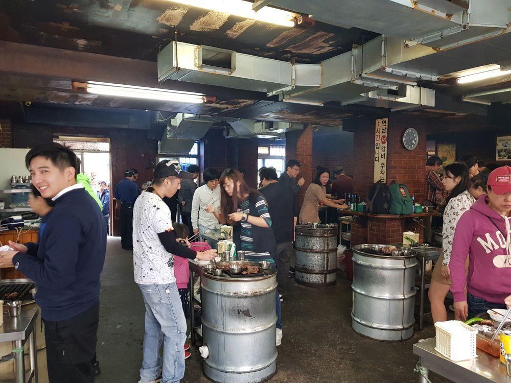 Sizzling chunks of Galbi cooked over an open flame grill, offering a glimpse of Korea’s beloved beef BBQ tradition.